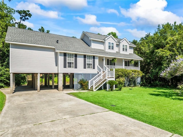 view of front of house with a porch, a front lawn, and a carport