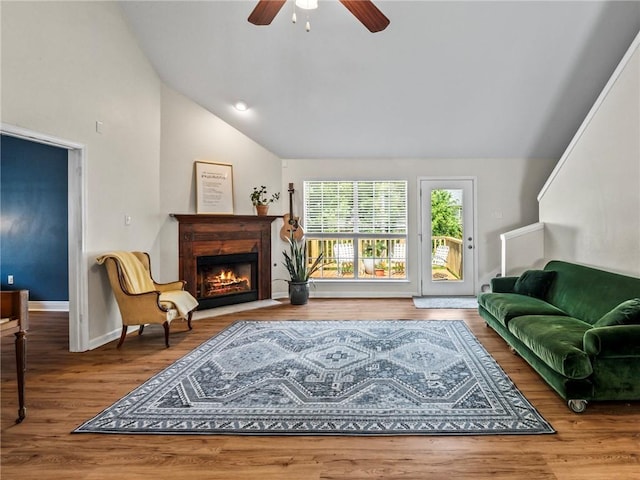 interior space featuring hardwood / wood-style floors, vaulted ceiling, and ceiling fan