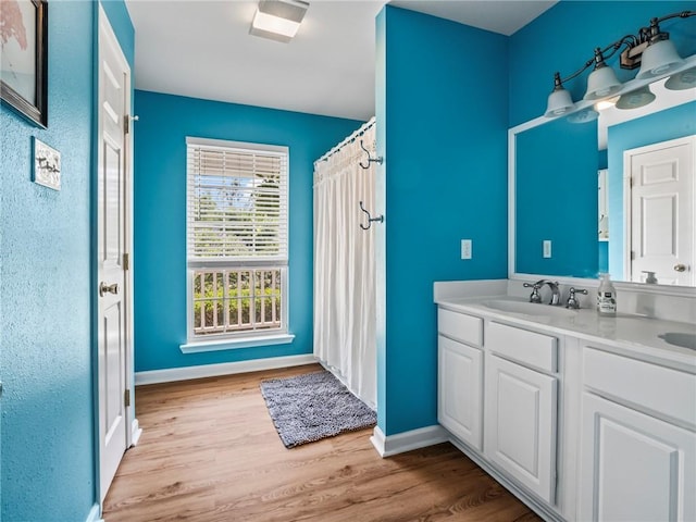 bathroom with vanity and hardwood / wood-style floors