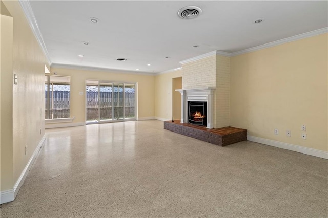 unfurnished living room featuring crown molding, brick wall, and a brick fireplace