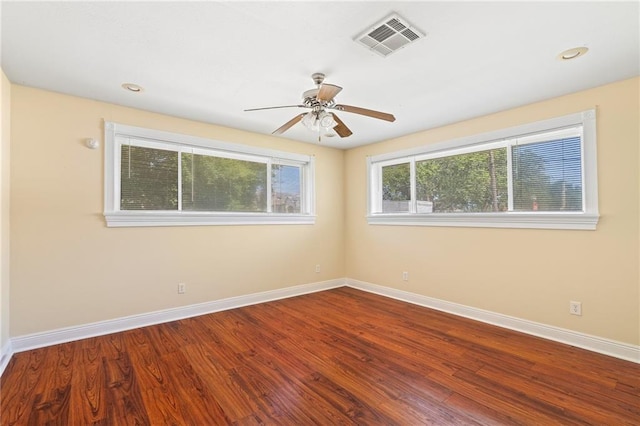 spare room with ceiling fan and wood-type flooring