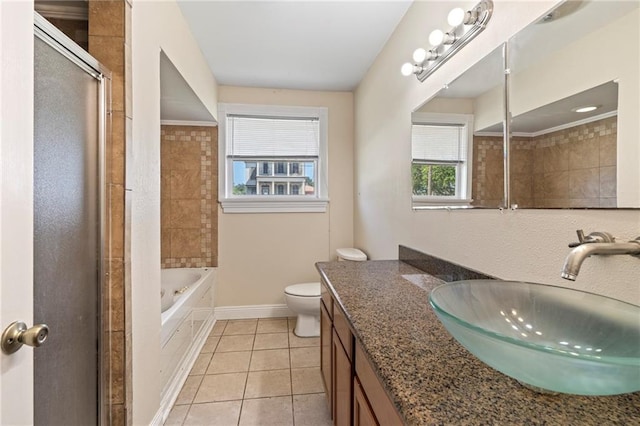 full bathroom featuring separate shower and tub, toilet, tile patterned floors, and vanity