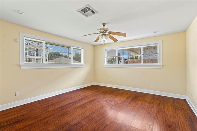 unfurnished room with ceiling fan and hardwood / wood-style flooring