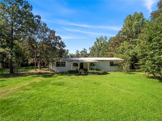 back of house featuring a yard