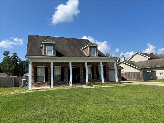 cape cod house with a garage, brick siding, fence, and a front lawn