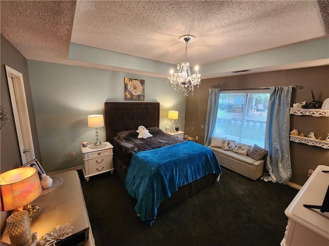 carpeted bedroom with an inviting chandelier and a textured ceiling