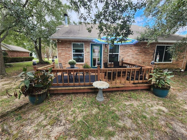 back of house featuring a deck