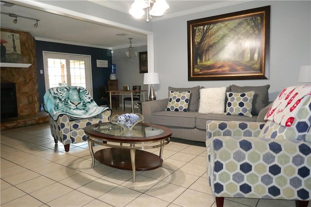 living room featuring light tile patterned floors, a fireplace, crown molding, and an inviting chandelier