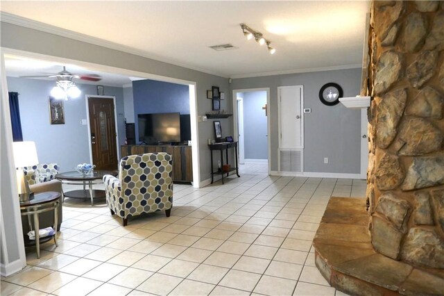 living room featuring ceiling fan, light tile patterned floors, crown molding, and track lighting