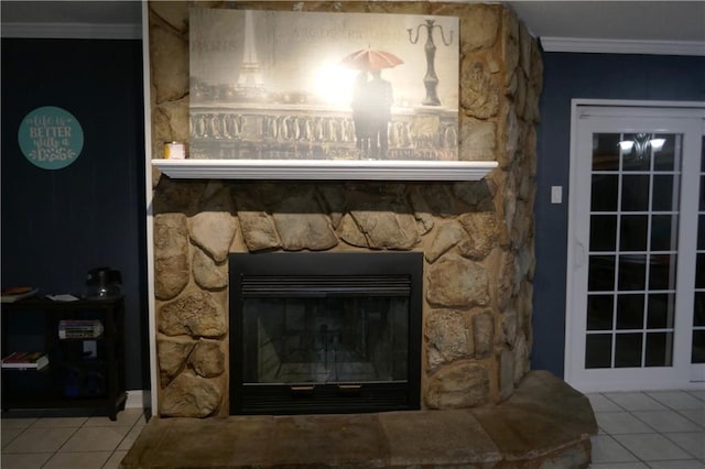 room details featuring crown molding, tile patterned flooring, and a fireplace