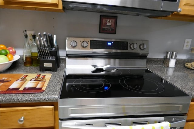 details with light brown cabinetry and range