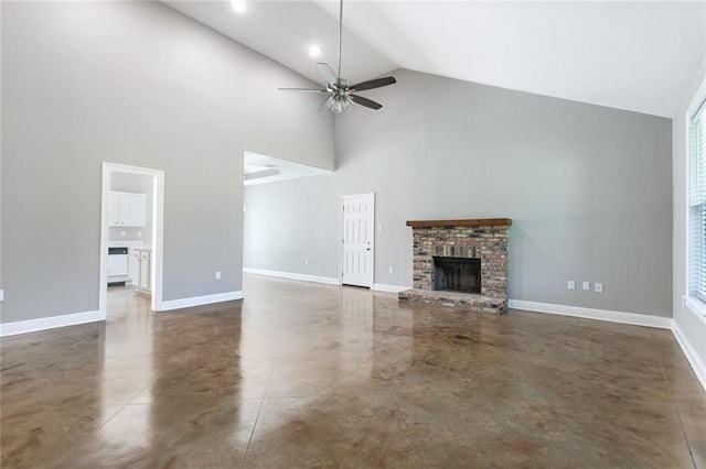 unfurnished living room featuring high vaulted ceiling, ceiling fan, and a brick fireplace