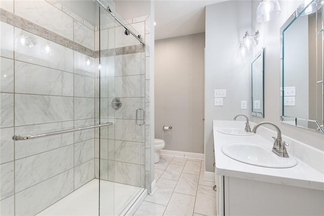 bathroom with tile patterned flooring, toilet, vanity, and a shower with shower door