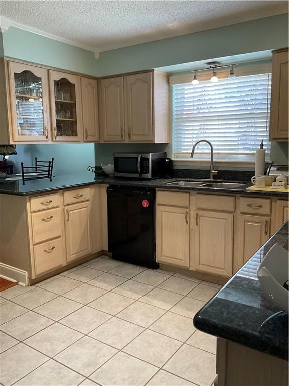 kitchen featuring black dishwasher, glass insert cabinets, stainless steel microwave, light brown cabinets, and a sink