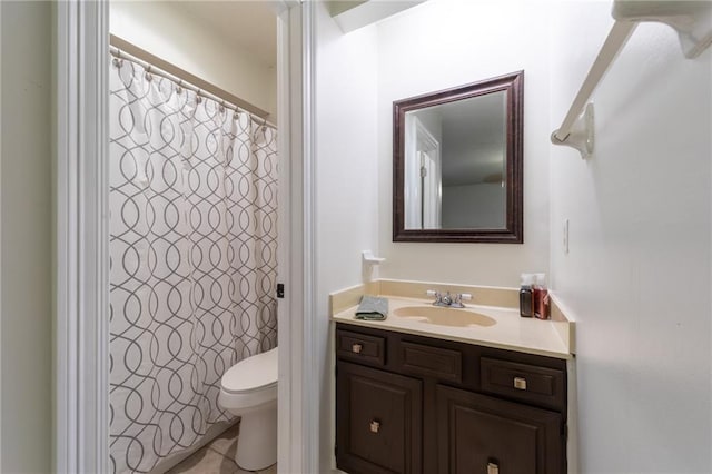 bathroom featuring curtained shower, toilet, and vanity