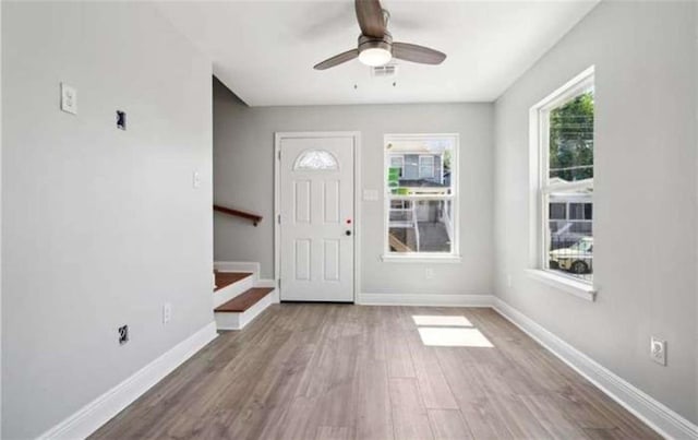 entrance foyer featuring ceiling fan and hardwood / wood-style flooring