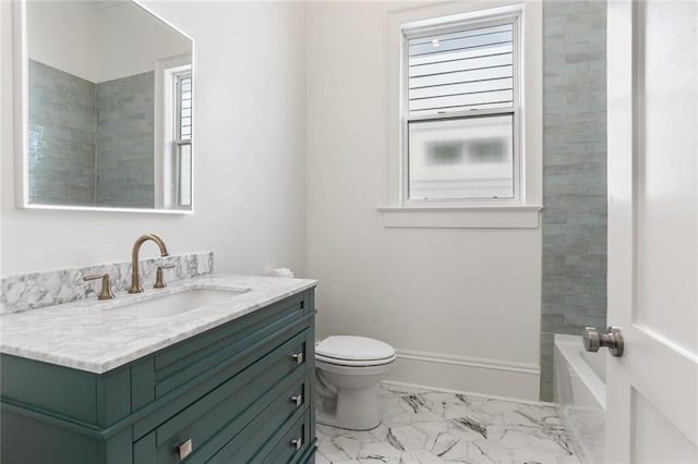 bathroom with toilet, vanity, and tile patterned floors