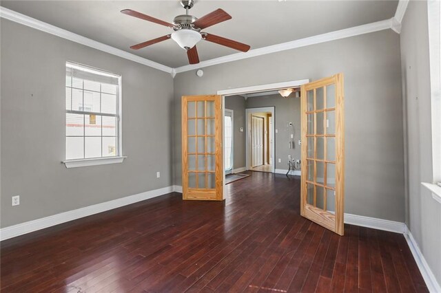 unfurnished room with crown molding, ceiling fan, and dark hardwood / wood-style flooring