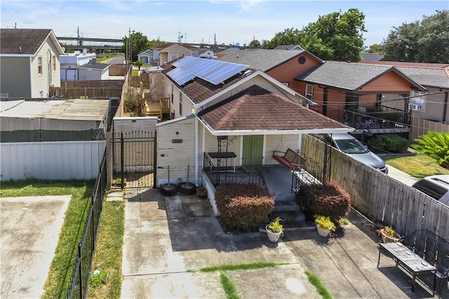 2546 Elder St, New Orleans, LA 70122 - rear view of property with a gate, a residential view, a porch, and fence