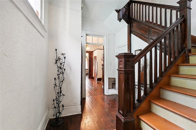 stairway with hardwood / wood-style flooring