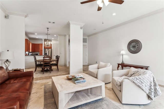 tiled living room with ceiling fan with notable chandelier and crown molding