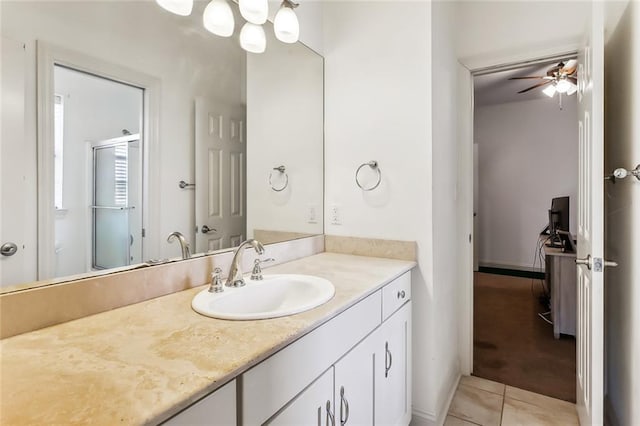 bathroom with ceiling fan, tile patterned flooring, and vanity