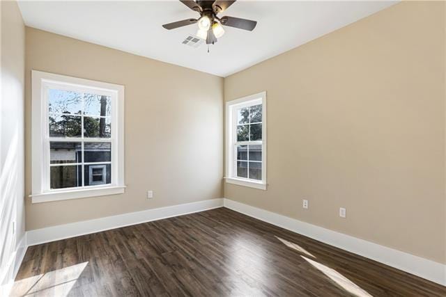 spare room with hardwood / wood-style floors, plenty of natural light, and ceiling fan