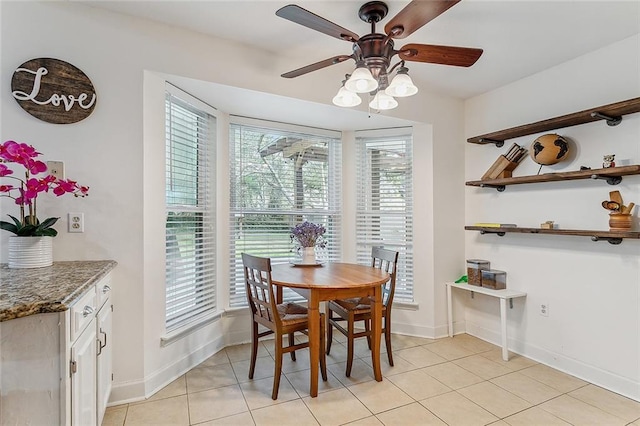 dining room with light tile patterned flooring and ceiling fan