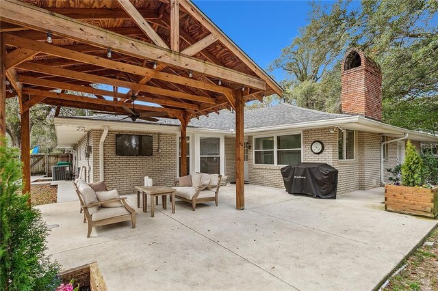 view of patio / terrace with ceiling fan, area for grilling, and an outdoor hangout area