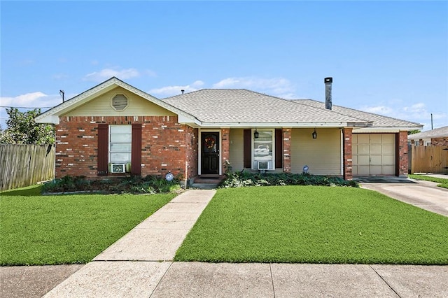 ranch-style house featuring a garage and a front lawn