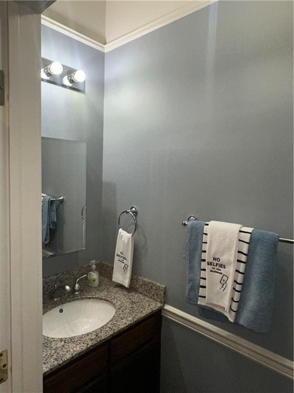 bathroom with vanity and ornamental molding