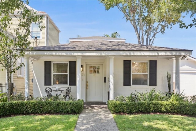 view of front of house featuring a garage and a front yard