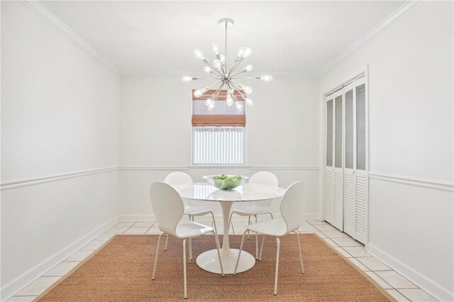 tiled dining room featuring a notable chandelier and ornamental molding