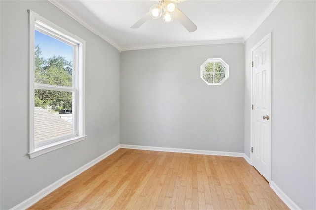 empty room featuring crown molding, ceiling fan, and light hardwood / wood-style floors