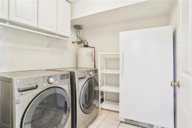 laundry room featuring separate washer and dryer, water heater, light tile patterned flooring, and cabinets