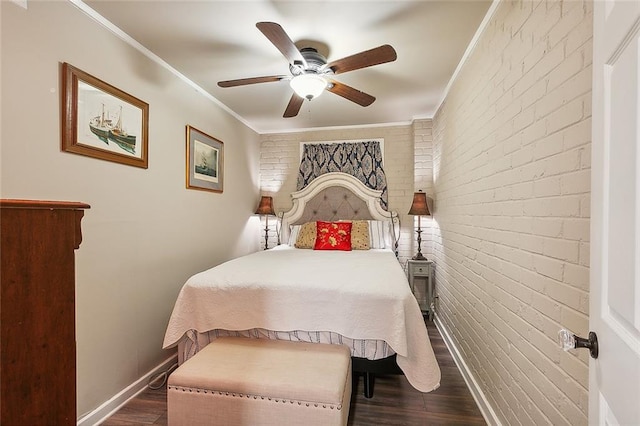 bedroom with ceiling fan, crown molding, dark hardwood / wood-style floors, and brick wall