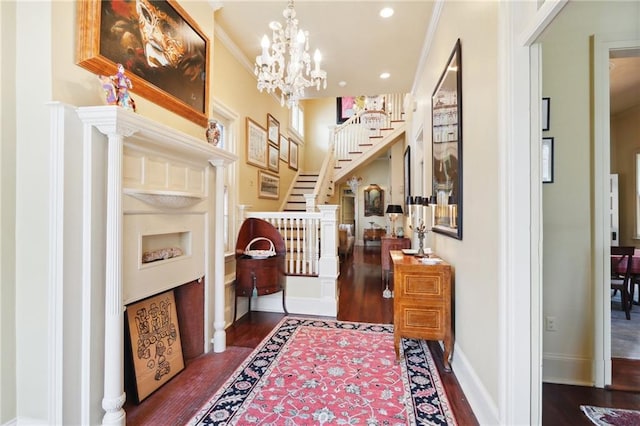 interior space with dark hardwood / wood-style floors, an inviting chandelier, and ornamental molding