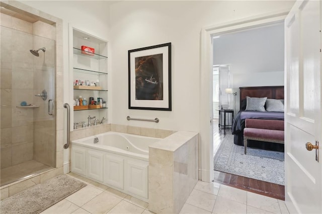 bathroom with tile patterned flooring and plus walk in shower