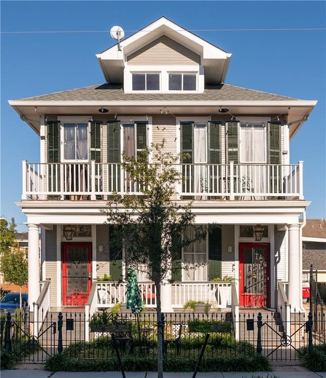 view of front of house featuring a porch and a balcony