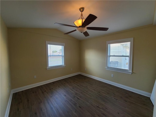 empty room with lofted ceiling, baseboards, dark wood-type flooring, and ceiling fan