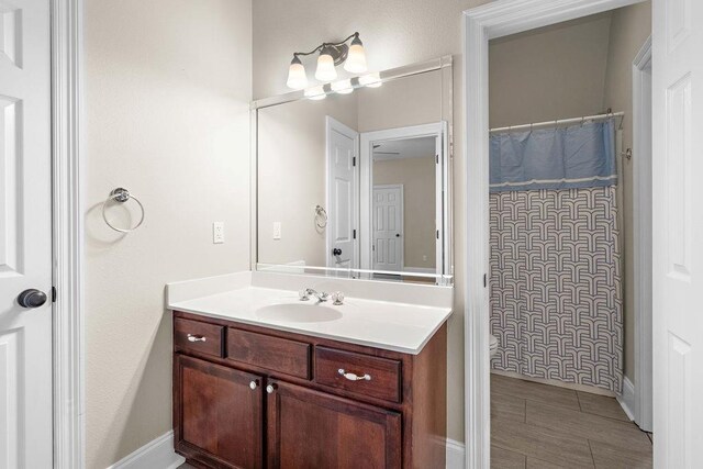 bathroom with tile patterned flooring and vanity