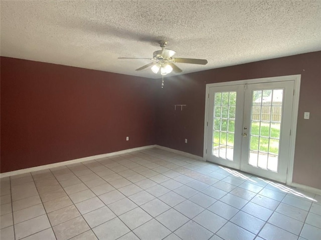 unfurnished room with ceiling fan, a textured ceiling, french doors, and light tile patterned flooring