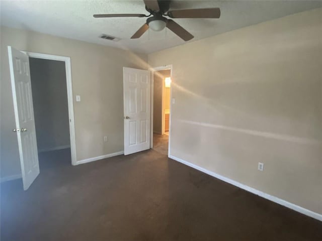 unfurnished bedroom featuring ceiling fan