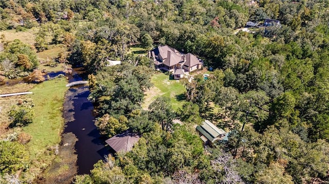 aerial view with a water view and a view of trees