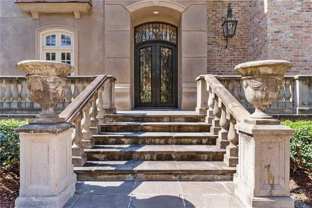 property entrance featuring french doors