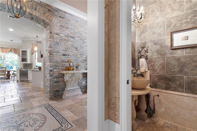 bathroom with tile patterned floors and ornamental molding