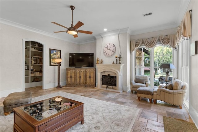 living area featuring stone tile floors, visible vents, and baseboards