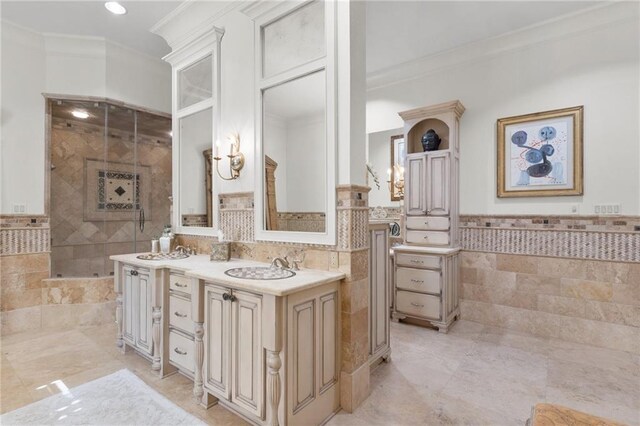 bathroom featuring tile walls, tile patterned flooring, vanity, and ornamental molding