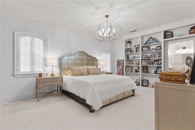 carpeted bedroom featuring crown molding and an inviting chandelier