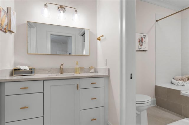 full bathroom featuring toilet, tile patterned flooring, and vanity